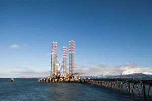 Homer Prints: Jack-up rig parked at the harbor in Homer Alaska in winter on a sunny day