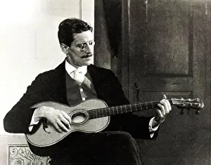 Historic Image Prints: James Joyce playing a guitar