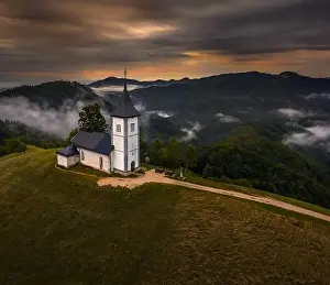 Julian Alps Prints: Jamnik, Slovenia - Aerial drone view of a golden sumer sunrise at Jamnik St