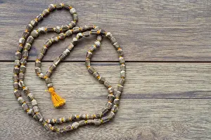 Blank Space Prints: Japa Mala Beads with Ample Copy Space on Rustic Wood Background