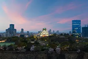 Japan cityscape at dusk. Landscape of Osaka business building around Osaka castle. Modern high building in business district area at dusk in Japan