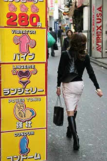 Shibuya Prints: Japan Tokyo Japanese lady walk past sex schop in the Shibuya district of Tokyo Japan Pawel Jaszczuk