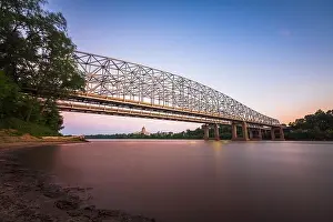 Jefferson City, Missouri, USA downtown view on the Missouri River with the State Capitol at dusk