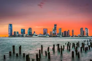 Hoboken Prints: Jersey City, New Jersey, USA skyline across the Hudson River after sunset