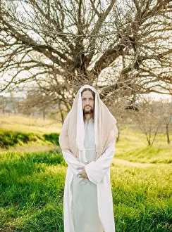 Robe Prints: Jesus Christ standing in meadow clothed in his traditional white robe against tree background