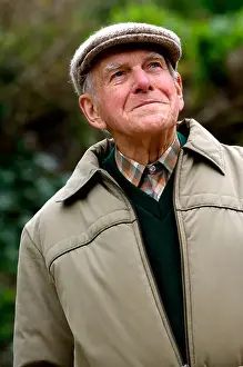 Jim Fern, known as Little Jim in Cider with Rosie by Laurie Lee sitting on a bench in Slad, Gloucestershire