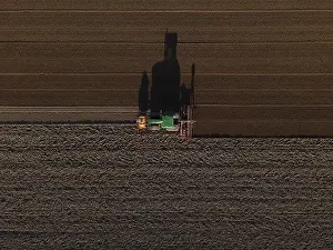 Seeding Prints: A John Deere Tractor seeds a previously cultivated field with sweetcorn