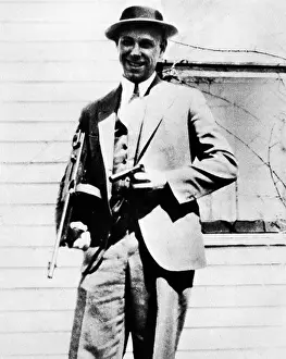 Thompson Prints: John Dillinger 1933 photo of the American Public Enemy Number One posing for the camera with his tommy gun