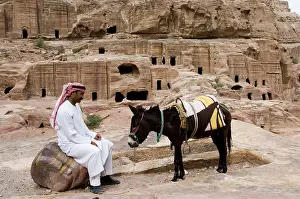 Donkeys Prints: Jordan Petra rock-diggers stone man sits donkeys no models East-Jordan-country Edom city rock-city release Near east