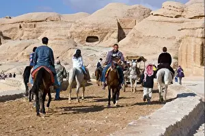 Petra Prints: Jordan Petra tourists are riding to the entrance of the canyon Bab es-Sik