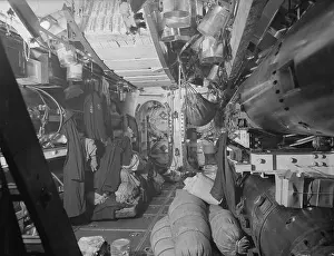 Armament Prints: In July 1942, interior views of HM Submarine Tribune at Scapa Flow highlighted the torpedo compartment