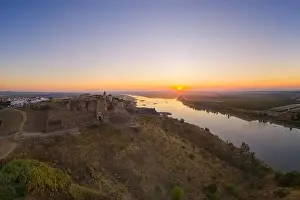 Juromenha castle, village and Guadiana river drone aerial view at sunrise in Alentejo, Portugal