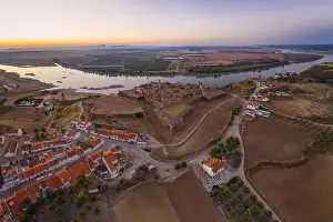 Juromenha castle, village and Guadiana river drone aerial view at sunset in Alentejo