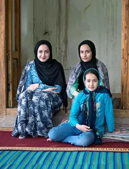 Sisters Prints: Kang, Iran - July 30, 2016 : portrait of three iranian sisters wearing colorful traditional clothes