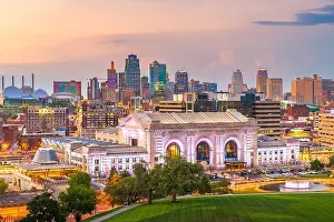 Kansas City, Missouri, USA downtown skyline with Union Station at dusk