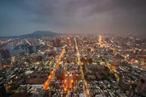 Kaohsiung, Taiwan cityscape at dusk from above looking towards Kaohsiung Harbor