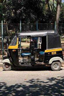 Hire Prints: Kerala Auto rickshaw ( Tuk Tuk ) (Auto taxi) parked in side of Road