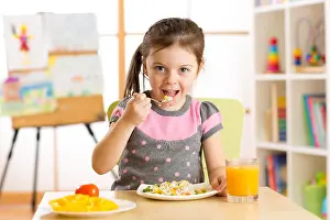 Expressing Prints: kid girl eating healthy food at home