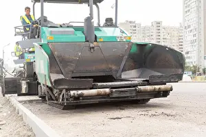 Cleanliness Prints: Kiev, Ukraine. August 13 2018 Road works. Road specialized equipment is laying the way