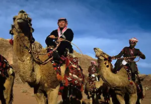 Camel Prints: King Abdullah II of Jordan rides a camel at Wadi Rum dressed in traditional Jordanian clothing while filming for