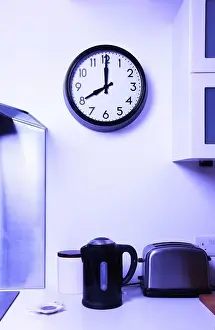 Kettle Prints: A kitchen wall clock at 8