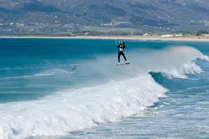 Windsurf Prints: Kitesurfer, jump, jumping, wave riding, kitesurf ride waves in Tarifa, Andalusia, Spain