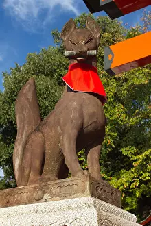 Kyoto Prints: Kitsune fox figure holding scroll of knowledge in its mouth at Fushimi Inari Taisha
