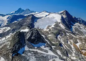 Tranquillity Prints: Kitzsteinhorn Glacier with rugged peaks under a clear blue sky