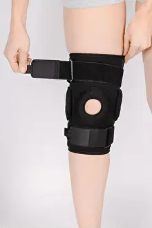 Elastic Prints: Knee Support Brace on leg isolated on white background