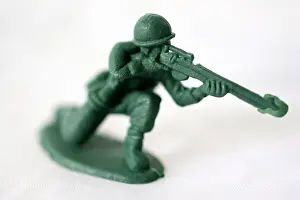 Kneeling Prints: kneeling toy plastic soldier holding rifle