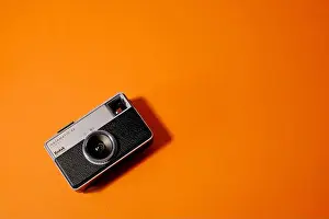 Cameras Prints: kodak instamatic 33 camera on orange background