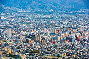 Kofu, Yamanashi, Japan downtown city skyline from the mountains at dusk