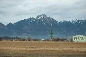 Julian Alps Prints: Kranj, power line tower with Triglav moutain on the background. Slovenia