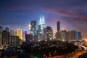 Images Dated 18th February 2017: Kuala Lumpur City skyline and skyscraper with highway road at night in Kuala Lumpur, Malaysia. Asia