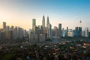 Twin Tower Prints: Kuala Lumpur city skyline and skyscrapers building during sunrise at business district downtown in Kuala Lumpur