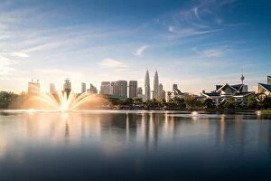 Images Dated 19th February 2017: Kuala Lumpur city skyscraper and fountation with nice sky morning at Titiwangsa Park in Kuala