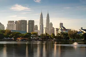 Kuala Lumpur city skyscraper and fountation with nice sky morning at Titiwangsa Park in Kuala Lumpur. Malaysia. Travel and Vacation concept