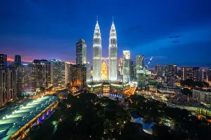 Kuala Lumpur city skyscraper and green space park with nice sky sunset at downtown business district in Kuala Lumpur. Malaysia. Malaysia tourism, mode