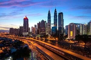 Images Dated 18th February 2017: Kuala Lumpur city skyscraper and highway street with nice sky sunrise at downtown business