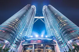 Kuala Lumpur Prints: KUALA LUMPUR - SEPTEMBER 16, 2015: The Petronas Towers viewed from below at night