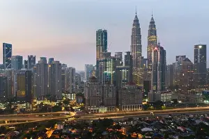 Kuala Lumpur skyline and skyscraper with highway road at night in Kuala Lumpur, Malaysia. Asia