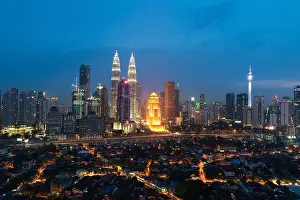 Kuala Lumpur skyline and skyscraper with highway road at night in Kuala Lumpur, Malaysia. Asia