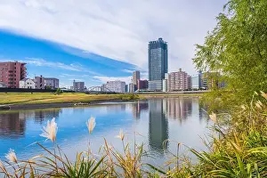 Kumamoto, Japan downtown cityscape on the Shirakawa River in the afternoon
