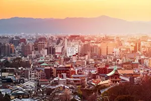 Kyoto, Japan downtown cityscape with new and old architecture at dusk