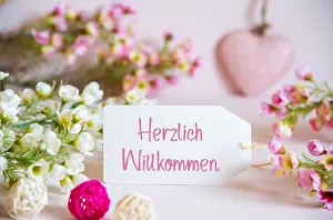 Spring Flower Prints: Label With German Text Herzlich Willkommen Means Welcome