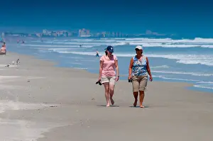 Miami Prints: Two ladies walking along the Cocoa beach In Florida
