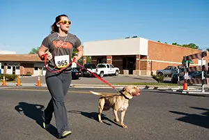 Marathon Prints: Lady 5k 10k marathon competitor racing toward finish line with dog