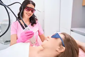 Goggles Prints: Lady is li in medical cabinet during laser hair removal