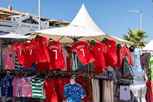Trader Prints: Lagos, Algarve, Portugal, market stall selling Cristiano Ronaldo portugal football shirts