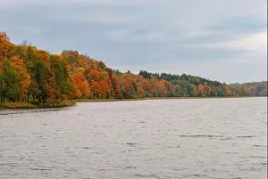 Lithuania Prints: Lake Asveja, the longest lake in Lithuania and colorful autumn deciduous trees near the town of Dubingiai